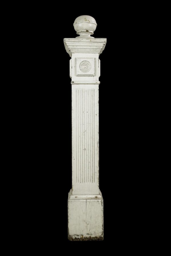 Antique white pine newel post with a ball top, bull's eye detail, and visible surface wear.