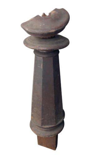 Antique traditional wooden newel post with a removable carved top and tapered base shown in full length.