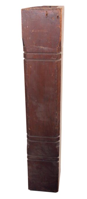 Antique traditional square wooden staircase newel post in dark wood tone, shown in full length with a stepped decorative profile and worn restored surface.