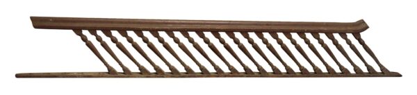 Brown wooden stair railing with 20 turned spindles shown in profile.