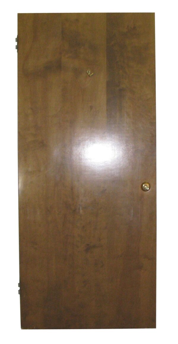 Single antique maple passage door with a dark wood tone, shown front-facing with a round knob and visible hinges.