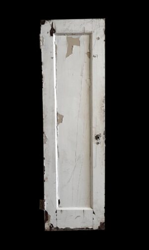 Narrow white wooden passage door with one vertical panel and visible wear, shown with some original hardware attached.