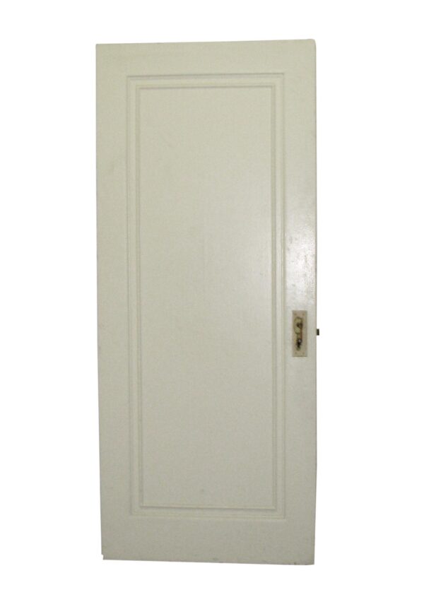 White antique one-panel passage door with a recessed panel and a hardware cutout on the right side.