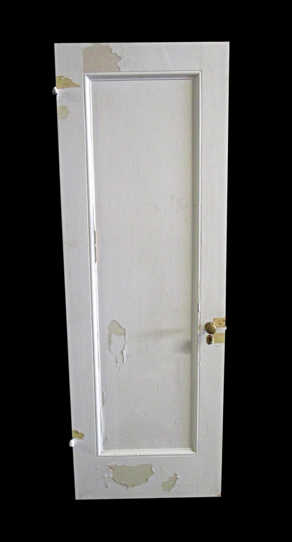Single white wooden passage door with one vertical panel and a right-swing latch, shown in full length with visible paint wear.