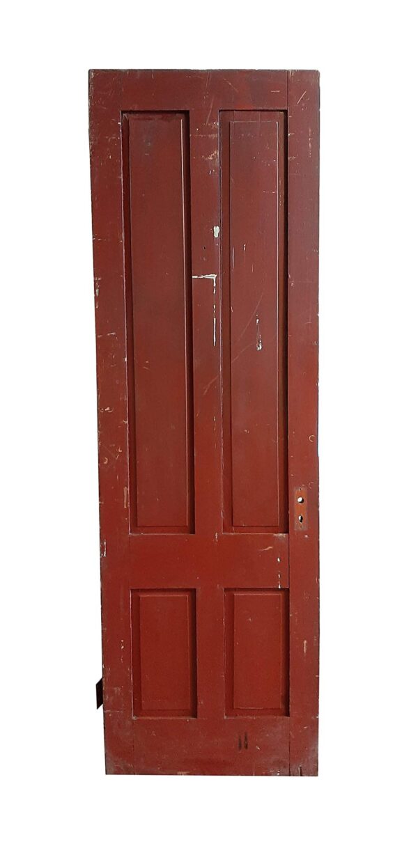 Antique wooden passage door with four panels, shown in burgundy on one side and with visible wear around the edges.