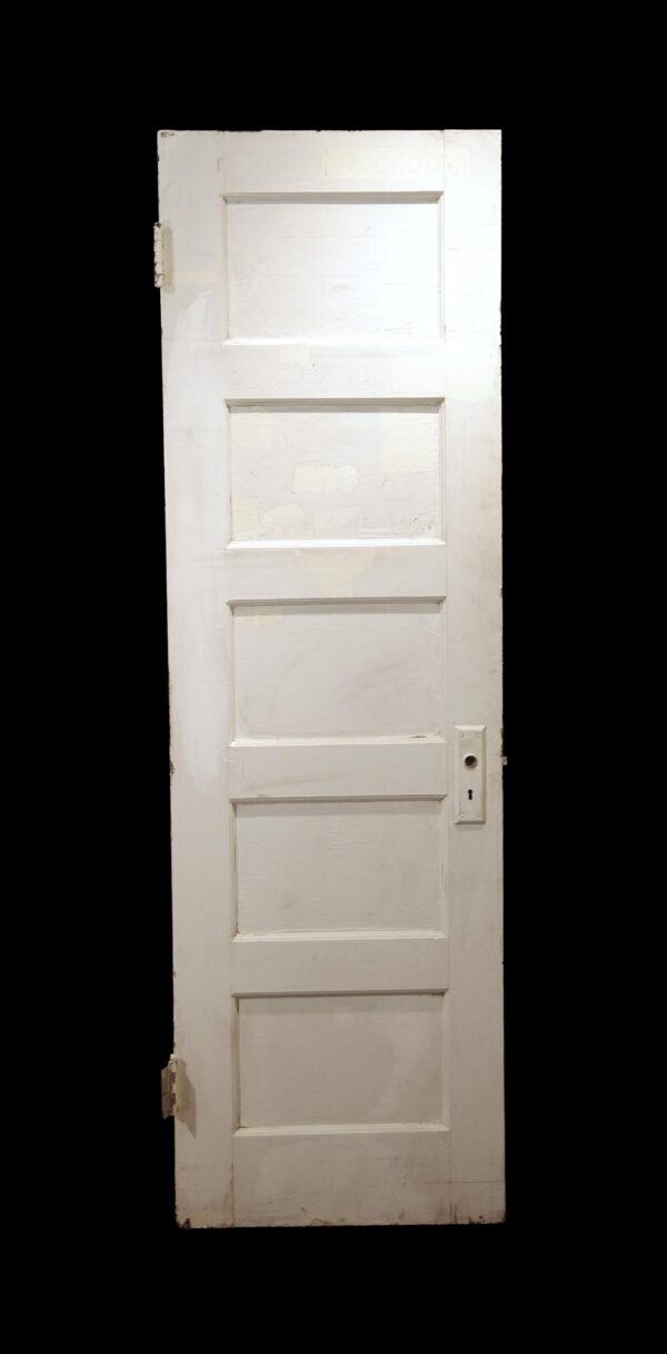 White wooden passage door with five horizontal panels and some attached hardware.