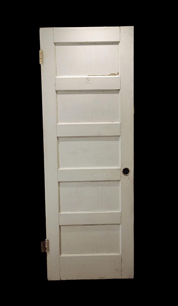 Antique white wood passage door with five horizontal panels and attached hinges, shown vertically against a plain background.