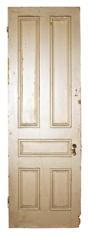 Antique wood passage door with five vertical panels and visible wear.
