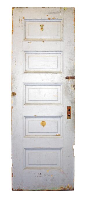 Antique five-panel wood privacy door shown in white paint, with worn edges and a visible latch opening on one side.
