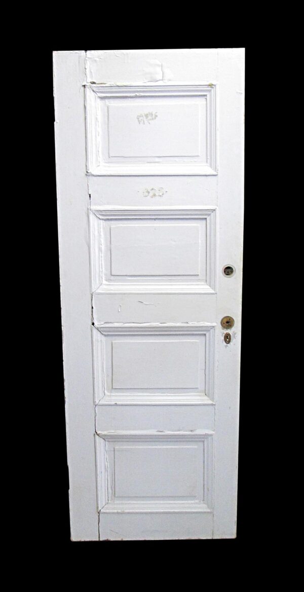 White four-panel wood passage door shown front-on, with visible wear and cracks along both sides and a right-side bore hole for hardware.