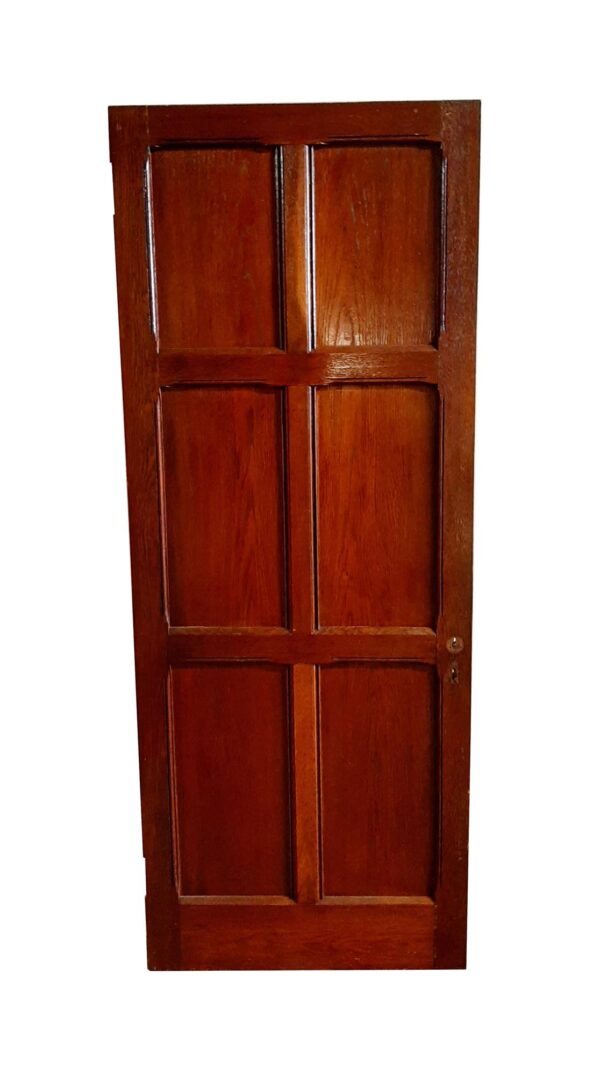 Arts and Crafts oak passage door with six vertical panels and a dark wood tone.