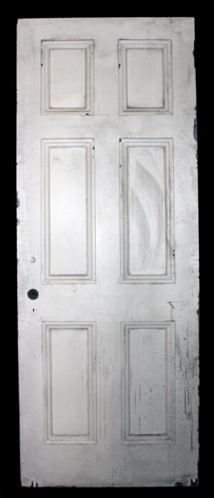 Antique white wood passage door with six raised panels shown front on.