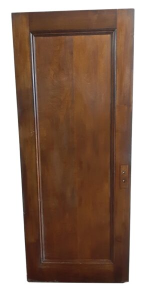 Dark wood tone walnut passage door shown with one recessed panel side and a visible lock plate on the edge.