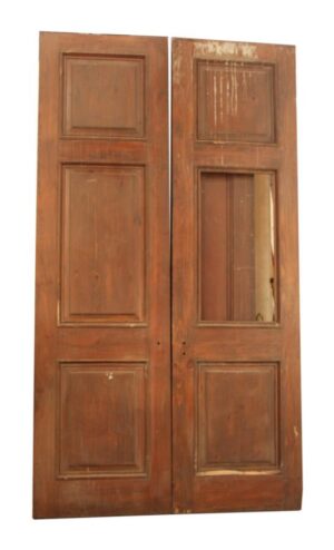 Pair of three-panel wooden doors in a dark wood tone, shown together with one door missing its center panel.