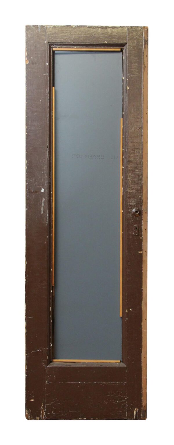 Single-panel wood door in a dark wood tone, shown with the plain reverse side and a narrow inset panel area.
