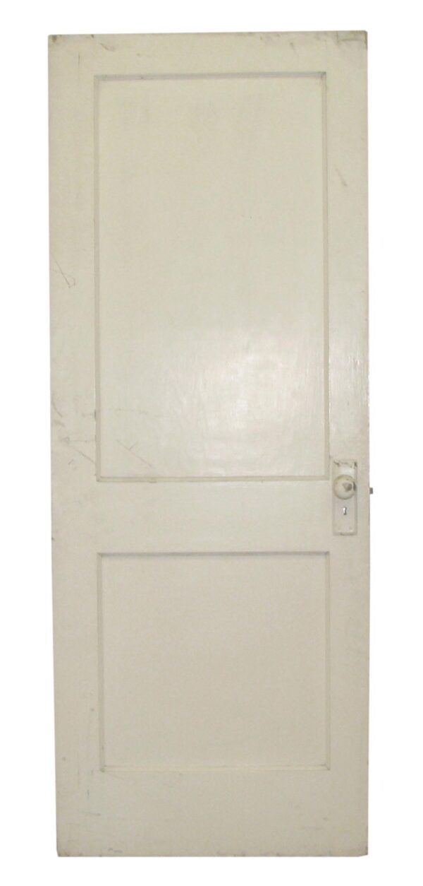 Vintage two-panel passage door shown front-on with a latch and keyhole visible on the right side.