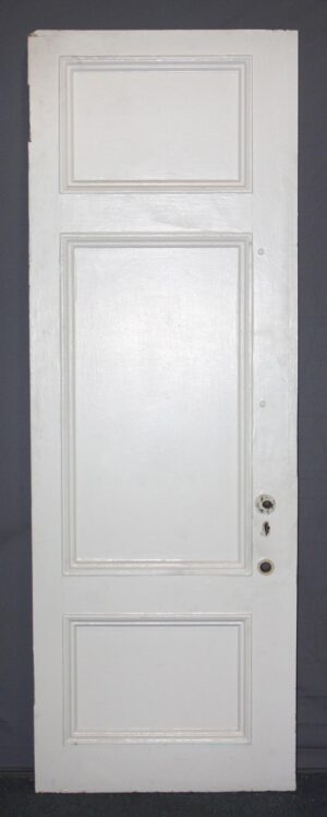 White wood privacy door with three raised panels, shown front view with hardware openings on the right side and a rectangular top panel.