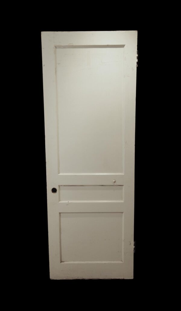 White wood passage door with three panels, shown front view without hardware.
