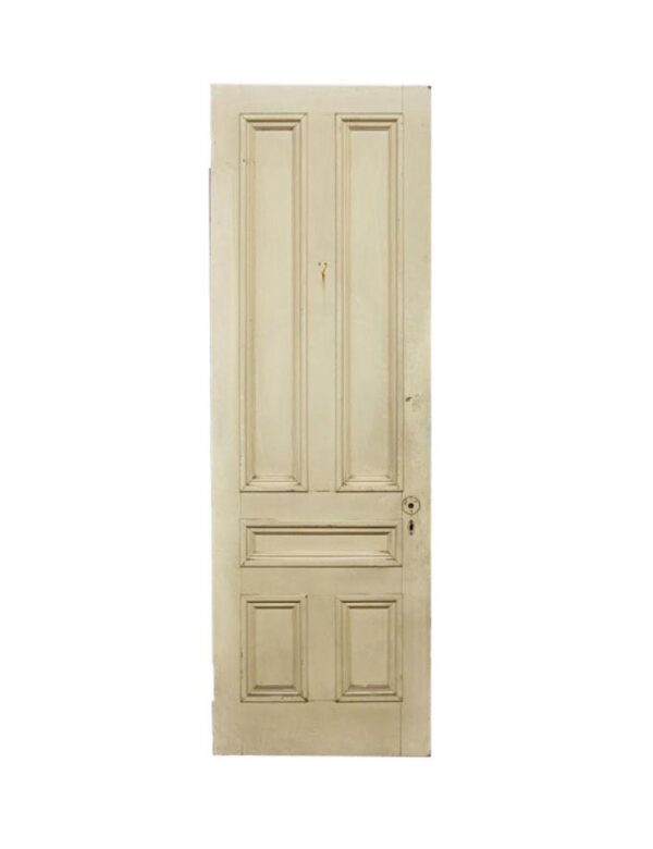 Vintage wood passage door with five panels and a yellow finish, shown upright with a keyhole and lock hardware visible on the right side.