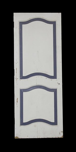 Painted white two-panel door with blue outlined arched panels and visible wear.