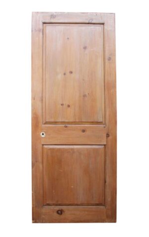 Vintage pine passage door with a two-panel side and medium wood tone, shown front on.
