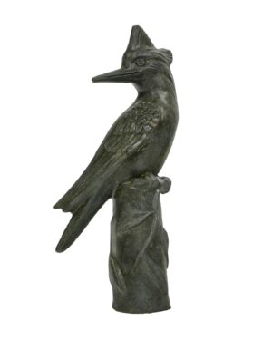 Black bronze woodpecker statue perched on a leafy log, shown in side profile with visible age wear.