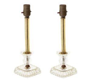Pair of traditional glass table lamps shown as a matching pair, with amber stems and clear cast bases.