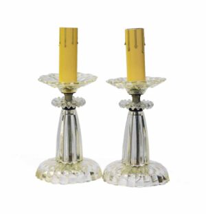 Pair of clear glass vanity table lamps with fluted bases and matching candle sleeves, shown as a pair.