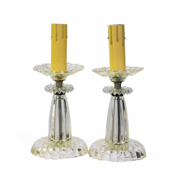 Pair of clear glass vanity table lamps with fluted bases and matching candle sleeves, shown as a pair.