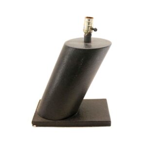 Black metal table lamp with a slanted cylindrical base and exposed bulb socket on top.