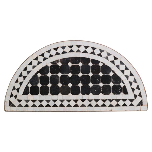 Arched black and white mosaic table top with a steel frame and semicircular tile pattern.