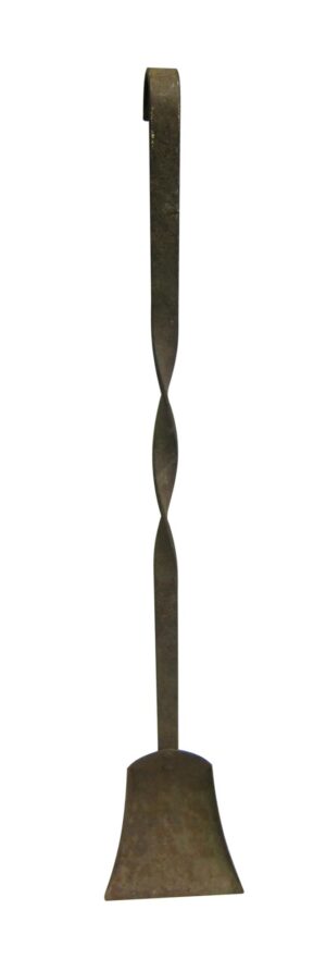 Single wrought iron fireplace shovel with a long twisted handle and a wide flat scoop.