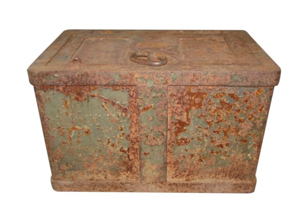 Rustic cast iron safe box with a heavily rusted exterior and latch on top.