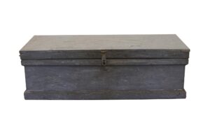 Vintage distressed blue wooden trunk with a flat lid and visible front latch.