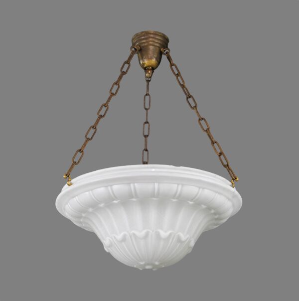 Antique white cast glass pendant light with an ornate dish shape, suspended by three chains from an antique brass canopy, shown with minor chips along the rim and a bent finial.
