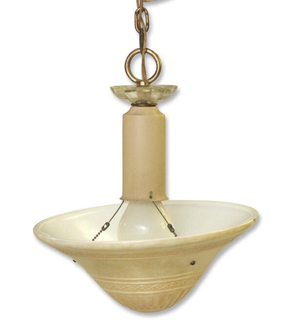 Mid century pendant light with a saucer-shaped shade, clear and tan glass, and antique brass hardware.