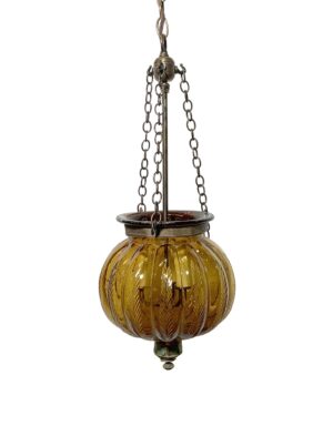 Amber crystal glass pendant light with an antique brass chain and a pumpkin-shaped bell jar shade.