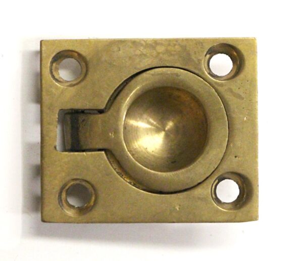 Rectangular brass recessed cabinet pull with four mounting holes and a rounded finger recess.