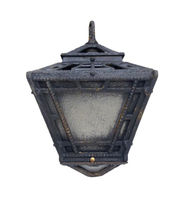 Arts and Crafts exterior hanging lantern with a frosted glass panel and black iron frame, shown from below.