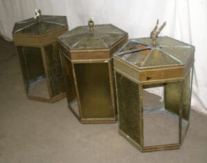 Three hexagonal pendant lanterns with missing glass panels and top rings, shown in a grouped side view.