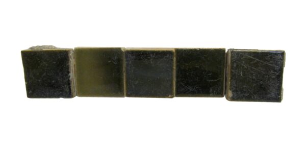 Set of five dark green square ceramic tiles with visible age-related imperfections and minor chips along the edges.