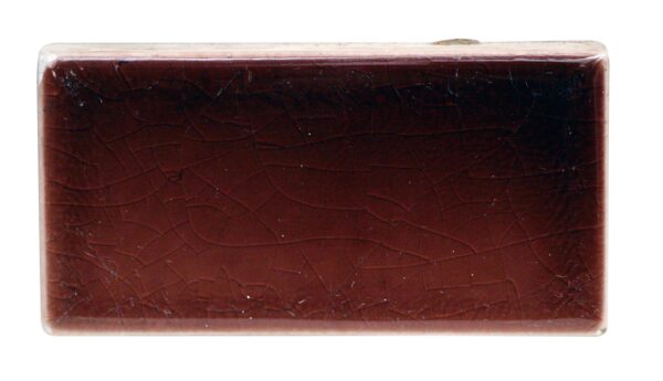 Single rectangular ceramic hearth wall tile with a crackled surface and rounded edges, shown front on.