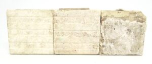 Set of three brown ceramic square tiles shown side by side, with visible age-related imperfections and minor chips and scrapes.