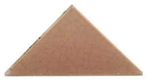 Pink crackled triangular ceramic tile with minor chips and age wear.