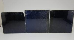 Set of three blue ceramic tiles with minor chips and scrapes, shown side by side as a grouped set.