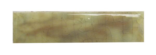 A close-up of a rectangular ceramic crackle tile with tan tones and a blue-gray cast, shown as a single piece.