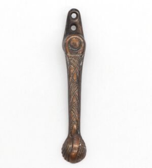 Decorative window latch with two mounting holes and a textured handle, shown in a vertical close-up view with the catch end visible.
