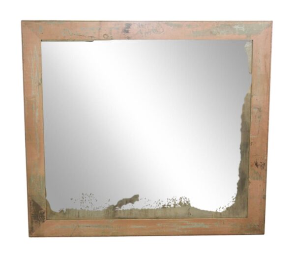 Square wall mirror with an antique pink wooden frame and visible distressed wear.