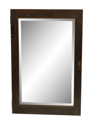 Wood-framed cabinet mirror door with beveled glass and visible wear along the edges.