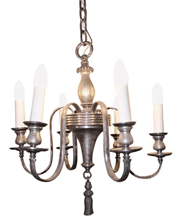 Six-light Federal chandelier with a silver-plated finish, scrolling arms, and candle-style sockets.